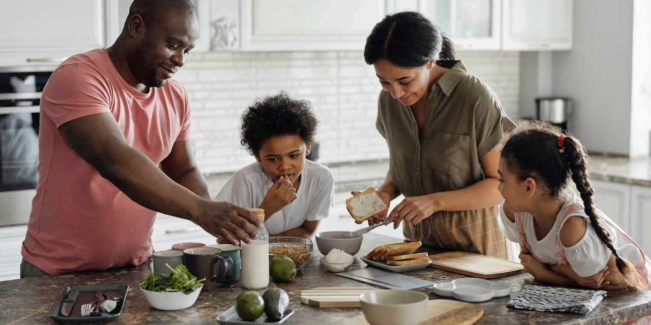 Didn't Claim Your Tax Benefits? There's Still Time A family of four gathered around a kitchen counter for breakfast